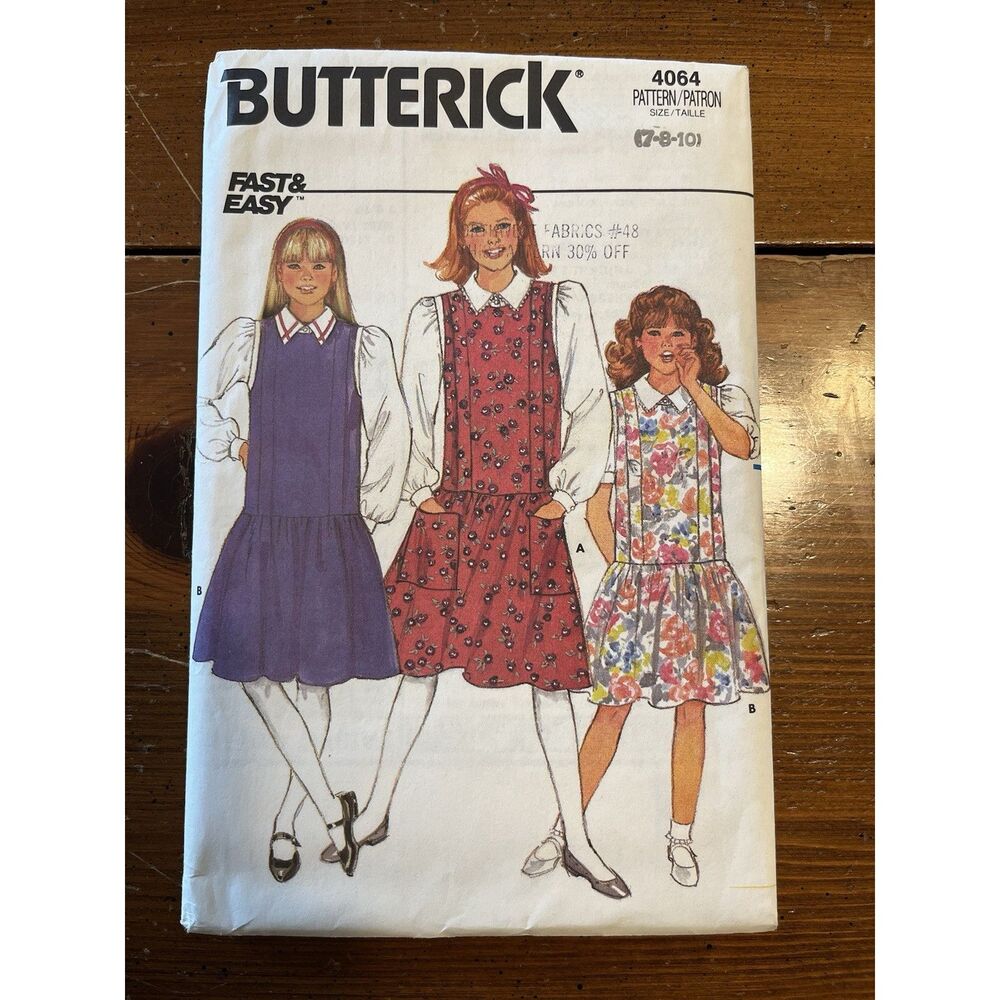 Vintage Butterick sewing pattern #4064 for girls dress and blouse. Classic late